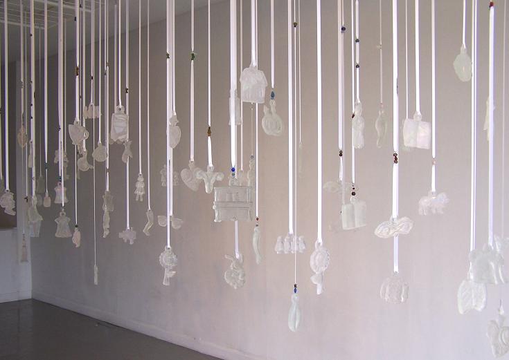 please thank you (partial installation); kiln cast glass, ribbon, beads; install. area 16" x 4"; 2005